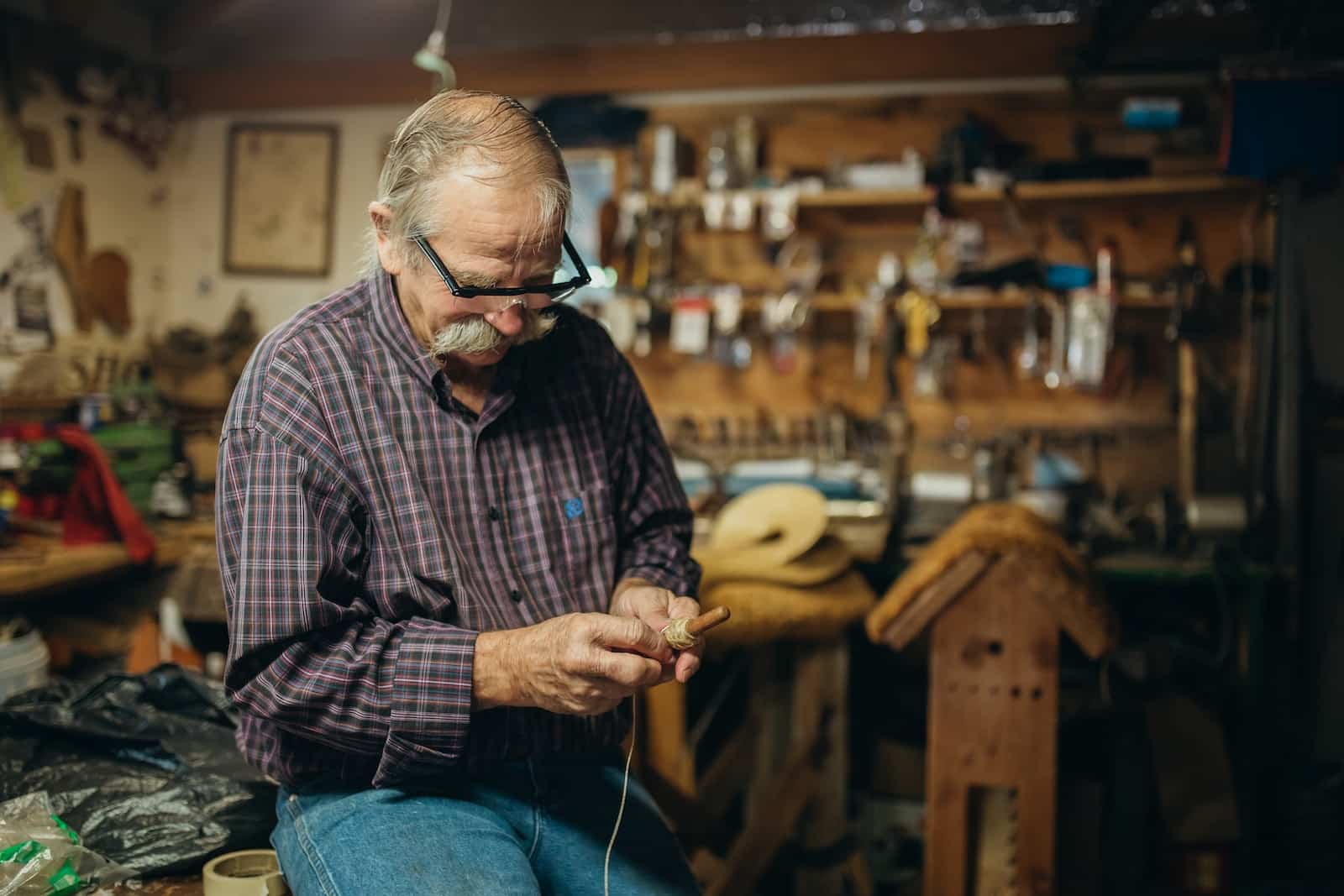 man repairing machine
